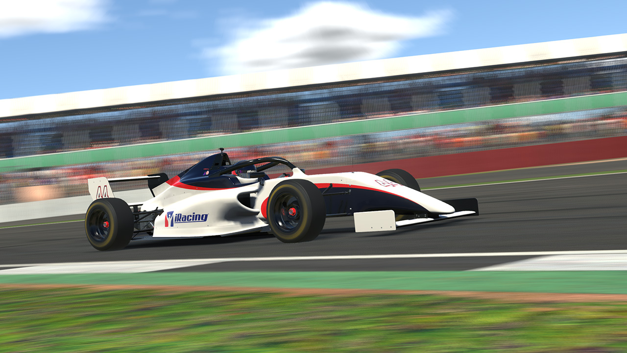 FIA F4 de iRacing, blanco, rojo y azul, en pista
